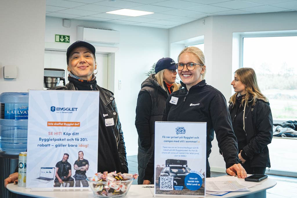 a group of men standing next to a coffee machine