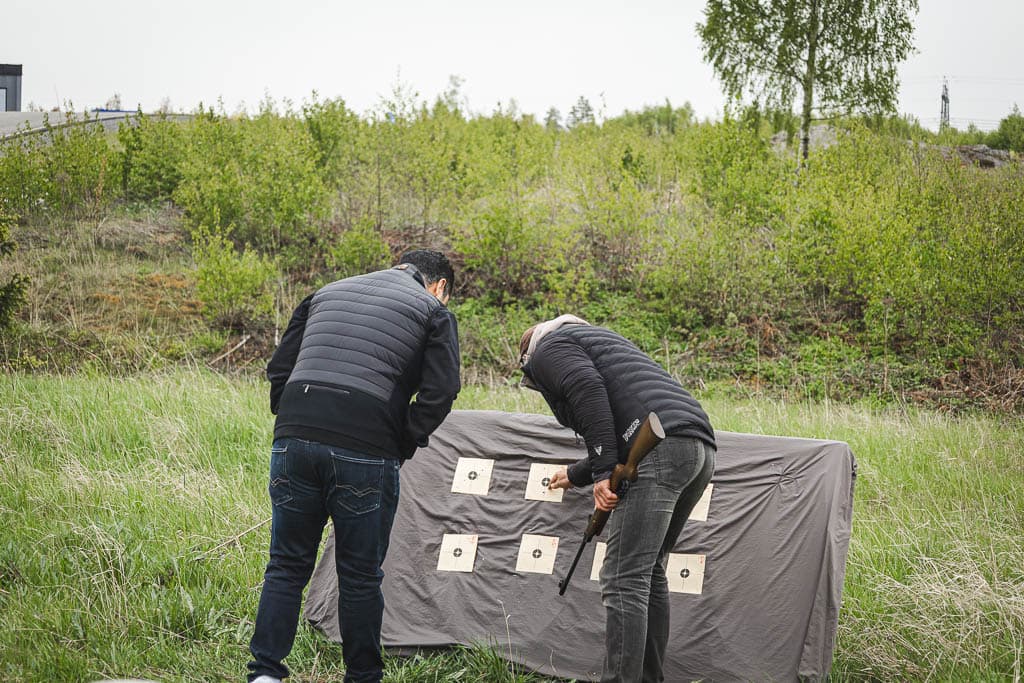 two men shooting at a target