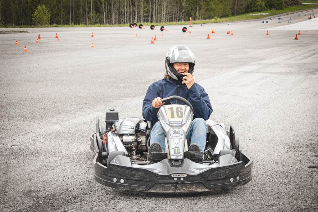 a man driving a go kart