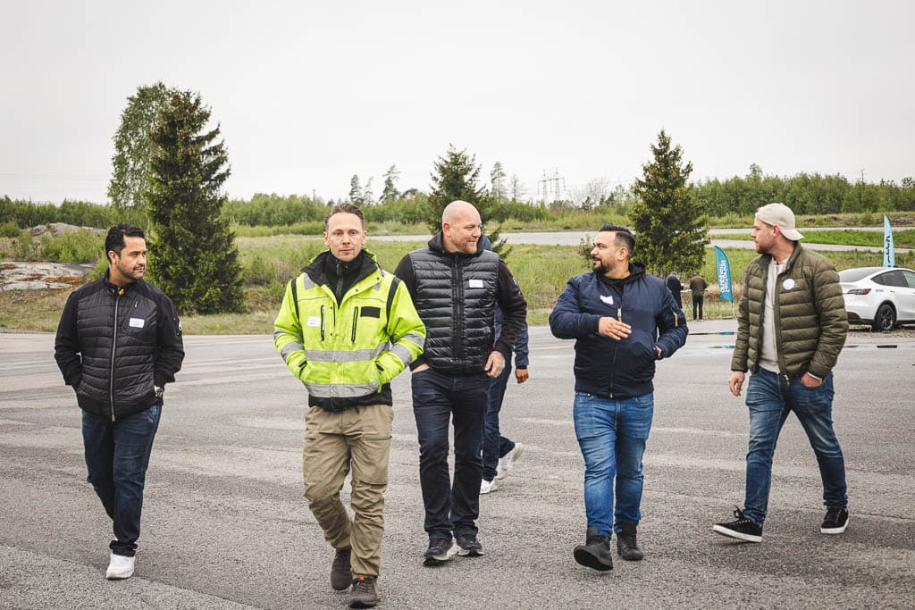 a group of men walking on a road