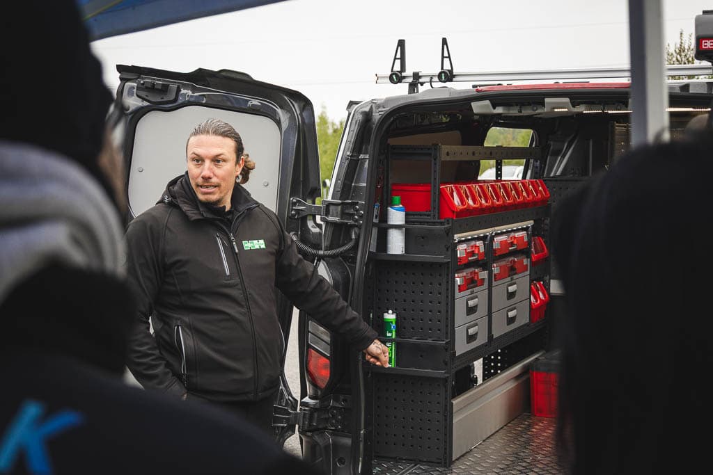 a man standing in front of a van