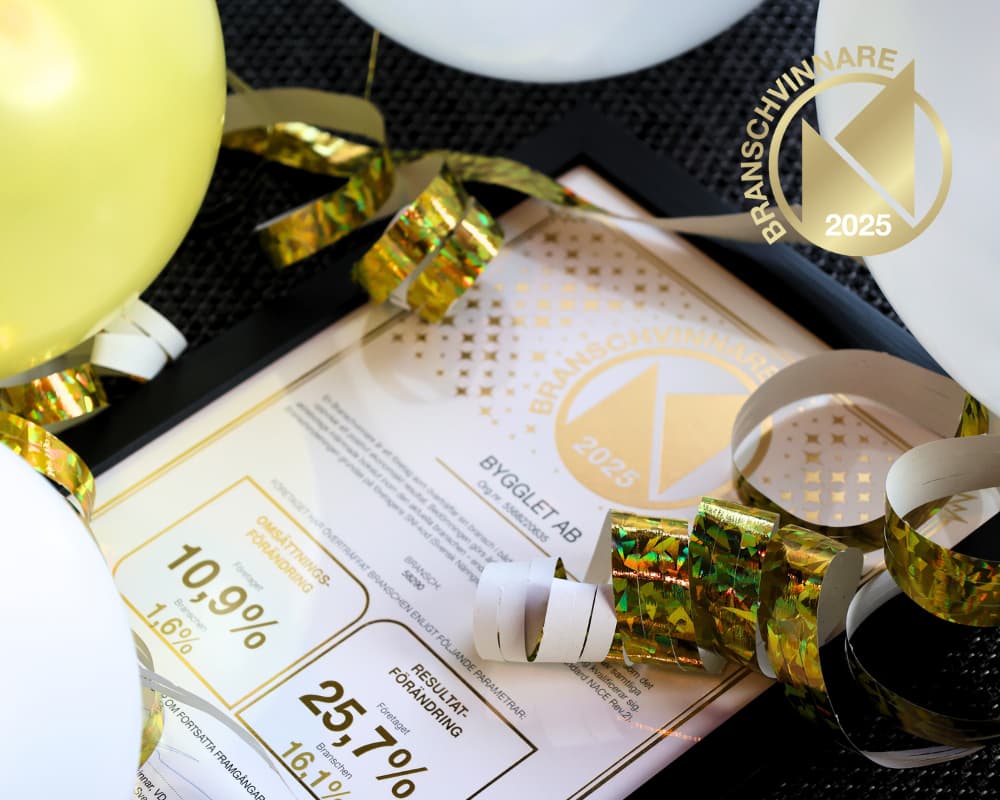 a framed certification with a gold ribbon and balloons